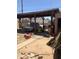 Large carport with potential for classic car restoration or outdoor projects in a private yard at 717 W Lynwood St, Phoenix, AZ 85007