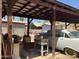 Spacious carport offering ample storage and workspace, showcasing potential for car enthusiasts and hobbyists at 717 W Lynwood St, Phoenix, AZ 85007