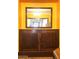 Vintage built-in cabinet and mirror feature in the bright dining area at 717 W Lynwood St, Phoenix, AZ 85007
