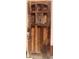 Rustic wooden front door with decorative details, adding charm and character to the home's entrance at 717 W Lynwood St, Phoenix, AZ 85007