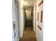 A hallway showcases paneled walls and wood floors, offering a view into multiple rooms at 717 W Lynwood St, Phoenix, AZ 85007