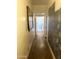 Long hallway with wood floors and potential for customization and a large framed print at 717 W Lynwood St, Phoenix, AZ 85007