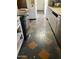 The kitchen showcases a patterned tile floor, stainless steel dishwasher, and a classic range at 717 W Lynwood St, Phoenix, AZ 85007