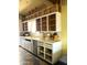 This kitchen features white cabinets, stainless steel appliances, and a vintage tile floor at 717 W Lynwood St, Phoenix, AZ 85007