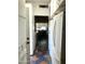 View of a galley style kitchen with white appliances and vintage flooring at 717 W Lynwood St, Phoenix, AZ 85007