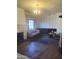 Spacious living room features a fireplace, hardwood floors, and ample natural light from a large window at 717 W Lynwood St, Phoenix, AZ 85007