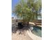 Backyard presents a shaded seating area with a pool nearby for enjoying the outdoors at 723 W Milada Dr, Phoenix, AZ 85041