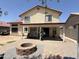 An inviting backyard with a brick patio, fire pit, and covered seating area, ideal for outdoor relaxation at 723 W Milada Dr, Phoenix, AZ 85041