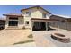 The backyard presents a covered patio and a fire pit to complete the outdoor living space at 723 W Milada Dr, Phoenix, AZ 85041