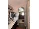 The bathroom sink leads to an archway that shows the main bedroom at 723 W Milada Dr, Phoenix, AZ 85041