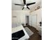 This bedroom features a ceiling fan, window, closet, and desk at 723 W Milada Dr, Phoenix, AZ 85041
