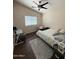 The bedroom features a ceiling fan, window, desk, and hanging chair at 723 W Milada Dr, Phoenix, AZ 85041