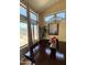 Bright dining room with backyard views, elegant chandelier, and ample natural light at 723 W Milada Dr, Phoenix, AZ 85041