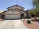 Charming two-story home features a spacious two-car garage and a desert landscaped front yard at 723 W Milada Dr, Phoenix, AZ 85041