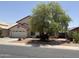 Charming two-story home features a spacious two-car garage and desert landscaping in the front yard at 723 W Milada Dr, Phoenix, AZ 85041