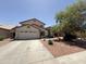 Charming two-story home features a spacious two-car garage and a desert landscaped front yard at 723 W Milada Dr, Phoenix, AZ 85041