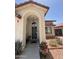 Front entrance with arched entryway and desert landscaping at 723 W Milada Dr, Phoenix, AZ 85041