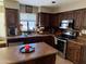 Well-appointed kitchen with dark cabinets, stainless appliances, and a cozy atmosphere at 723 W Milada Dr, Phoenix, AZ 85041