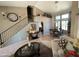 Spacious living area with staircase, dining area, and comfortable seating arrangement at 723 W Milada Dr, Phoenix, AZ 85041