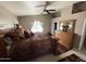 Spacious main bedroom suite with a ceiling fan, large window, and a dresser at 723 W Milada Dr, Phoenix, AZ 85041