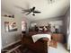This main bedroom features a ceiling fan, a large bed, and carpet at 723 W Milada Dr, Phoenix, AZ 85041