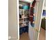 Well-organized pantry shelves with ample storage space, apron hanging on the door at 723 W Milada Dr, Phoenix, AZ 85041