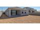 Spacious backyard with a covered patio provides a great outdoor living area at 7369 W Buckhorn Trl, Peoria, AZ 85383