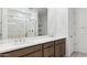 Bathroom features a double vanity with plentiful cabinet space and a large framed mirror at 7369 W Buckhorn Trl, Peoria, AZ 85383