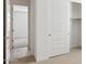 Bedroom featuring sliding closet doors, carpet, and wood look flooring at 7369 W Buckhorn Trl, Peoria, AZ 85383