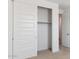 Bedroom closet with white sliding doors and a view to the carpeted interior at 7369 W Buckhorn Trl, Peoria, AZ 85383