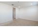 Spacious bedroom with neutral carpet, recessed lighting, and walk-in closet entrance at 7398 W Buckhorn Trl, Peoria, AZ 85383