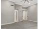 Large Primary bedroom with carpet, barn doors, and en-suite bath at 7525 E Gainey Ranch Rd # 118, Scottsdale, AZ 85258