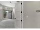 Spacious bedroom with ceiling fan, access to the backyard, and light grey carpet at 7525 E Gainey Ranch Rd # 118, Scottsdale, AZ 85258