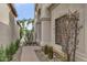 Inviting home entrance featuring a pathway, desert landscaping, and architectural details at 7525 E Gainey Ranch Rd # 118, Scottsdale, AZ 85258