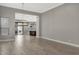 Open living area with wood-look floors leading into a stylish kitchen with stainless steel appliances at 7525 E Gainey Ranch Rd # 118, Scottsdale, AZ 85258