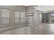 Large living room featuring wood-look flooring, ample natural light, and modern window coverings at 7525 E Gainey Ranch Rd # 118, Scottsdale, AZ 85258