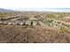 Expansive aerial view showing the layout of homes in this desert community at 7618 S Lone Pine Pl, Gold Canyon, AZ 85118