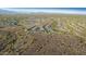 Aerial view of a desert community surrounded by mountains at 7618 S Lone Pine Pl, Gold Canyon, AZ 85118
