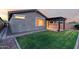 The backyard features a lush lawn and a covered patio area at 7618 S Lone Pine Pl, Gold Canyon, AZ 85118
