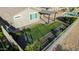 The backyard boasts a well manicured lawn, a pergola, and a beautiful inground swimming pool at 7618 S Lone Pine Pl, Gold Canyon, AZ 85118