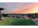 Spacious backyard with well-manicured lawn and desert landscaping at 7618 S Lone Pine Pl, Gold Canyon, AZ 85118