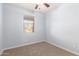 This cozy bedroom features plush carpeting and a window letting in natural light at 7618 S Lone Pine Pl, Gold Canyon, AZ 85118