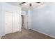 Bedroom features blue walls, carpet, and sliding door closet for ample storage at 7618 S Lone Pine Pl, Gold Canyon, AZ 85118