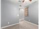 A carpeted bedroom showcasing its open layout and a decorative wall hanging at 7618 S Lone Pine Pl, Gold Canyon, AZ 85118