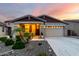 Charming single-story home with a well-lit front yard and desert landscaping at 7618 S Lone Pine Pl, Gold Canyon, AZ 85118