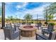 Community fire pit with string lights and chairs, perfect for outdoor gatherings at 7618 S Lone Pine Pl, Gold Canyon, AZ 85118