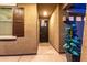 Covered front entrance with metal door, side window, and desert landscaping at 7618 S Lone Pine Pl, Gold Canyon, AZ 85118