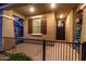 Charming covered front porch with iron fencing and desert landscaping at 7618 S Lone Pine Pl, Gold Canyon, AZ 85118