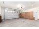 Spacious garage with ample storage cabinets and a functional overhead door at 7618 S Lone Pine Pl, Gold Canyon, AZ 85118