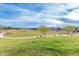 Expansive community green space with walking path at 7618 S Lone Pine Pl, Gold Canyon, AZ 85118
